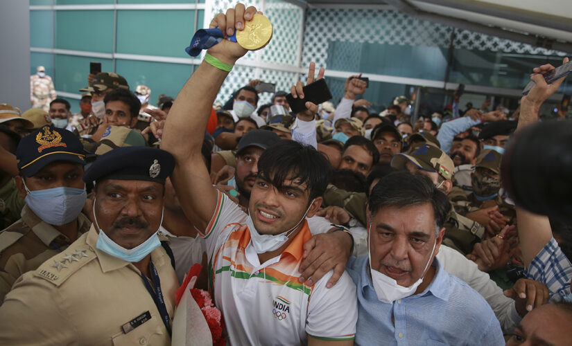 Olympic gold medalist Chopra returns to India as superstar
