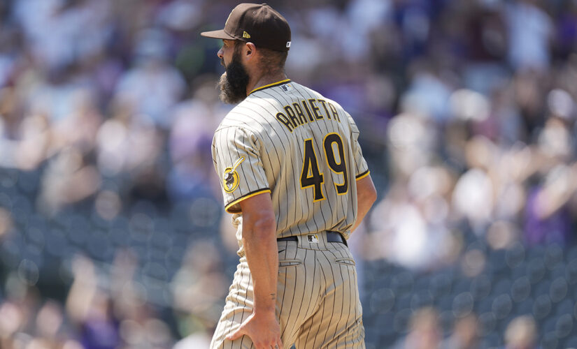 Arrieta rocked by Rockies, injured in Padres debut