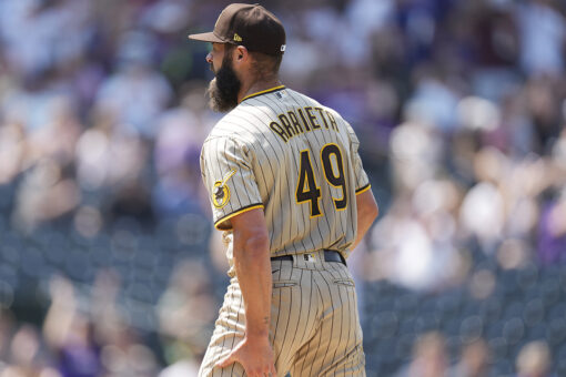 Arrieta rocked by Rockies, injured in Padres debut