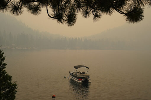 California fire advances toward Lake Tahoe after destroying hundreds of homes