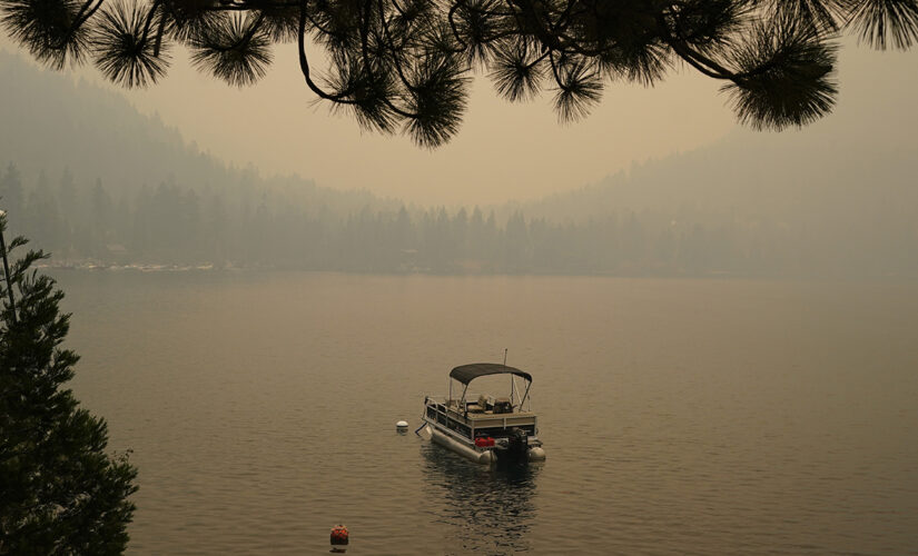 California fire advances toward Lake Tahoe after destroying hundreds of homes