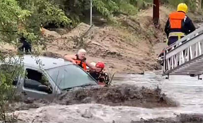 Arizona rescuers save 3 people trapped in vehicle from raging floodwaters, dramatic video shows