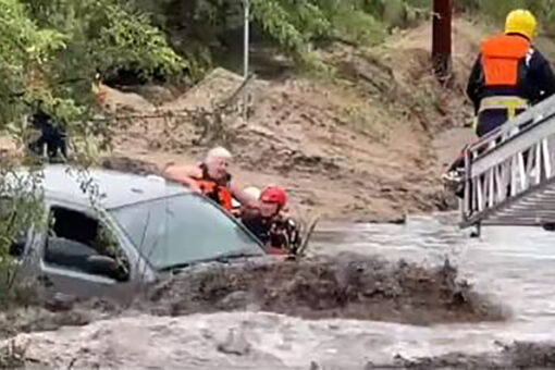 Arizona rescuers save 3 people trapped in vehicle from raging floodwaters, dramatic video shows
