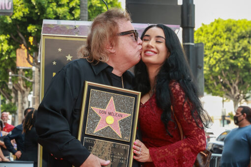 American Pie singer Don McLean, 75, kisses girlfriend Paris Dylan, 27, while receiving Walk of Fame star
