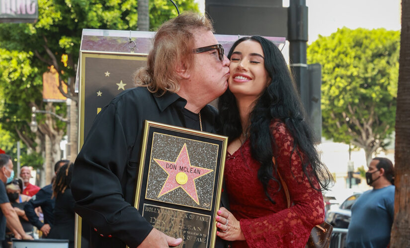 American Pie singer Don McLean, 75, kisses girlfriend Paris Dylan, 27, while receiving Walk of Fame star