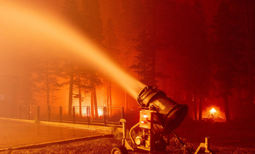 California firefighters use snow machines to fight Caldor Fire at Tahoe resort