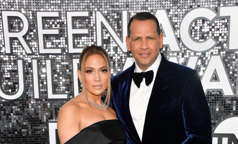 Alex Rodriguez poses with the Porsche he once gifted ex Jennifer Lopez