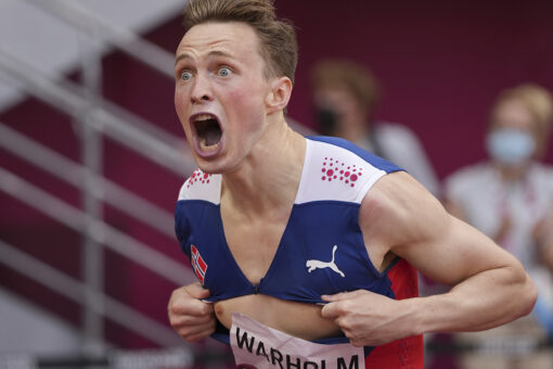 Norway’s Karsten Warholm breaks his own 400-meter hurdles world record, rips shirt in celebration