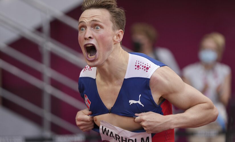 Norway’s Karsten Warholm breaks his own 400-meter hurdles world record, rips shirt in celebration