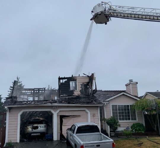 Washington man barricaded in burning building, shot at officers: police