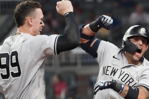 Yankees hit 3 HRs, hold off Braves 5-4 for 11th straight win