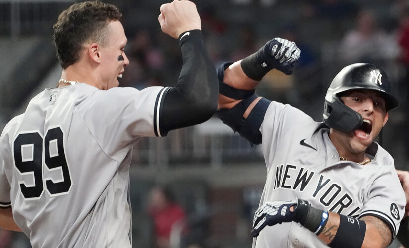 Yankees hit 3 HRs, hold off Braves 5-4 for 11th straight win
