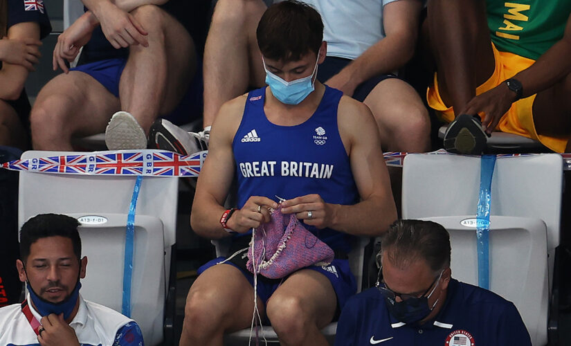 Great Britain’s Tom Daley knits on the sidelines of the Tokyo Olympics