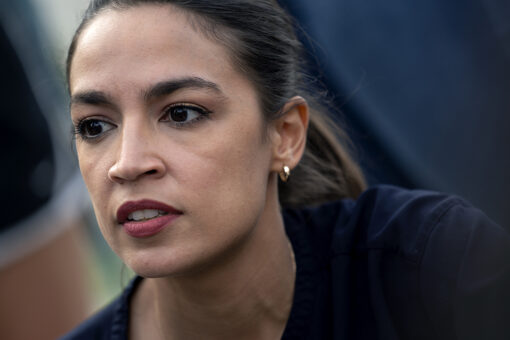 AOC puts on mask for picture, removes it afterward, video shows