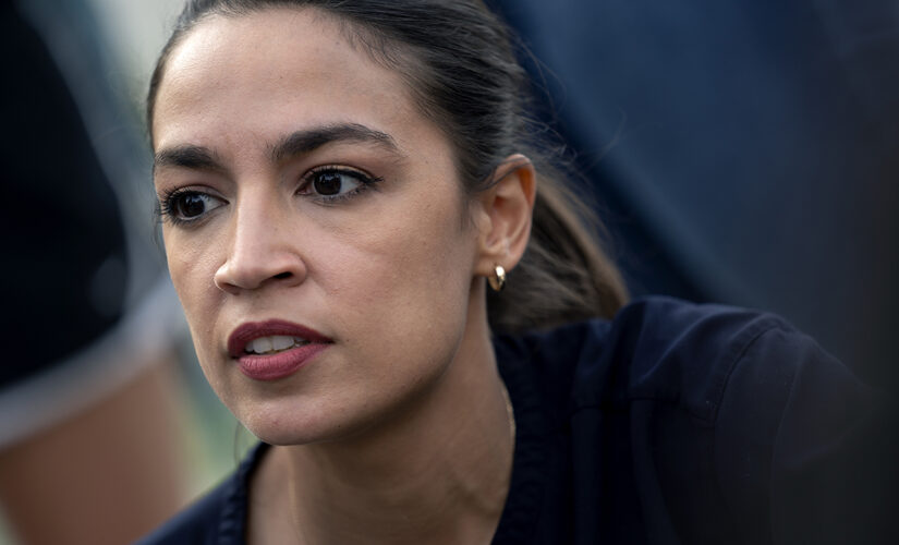 AOC puts on mask for picture, removes it afterward, video shows