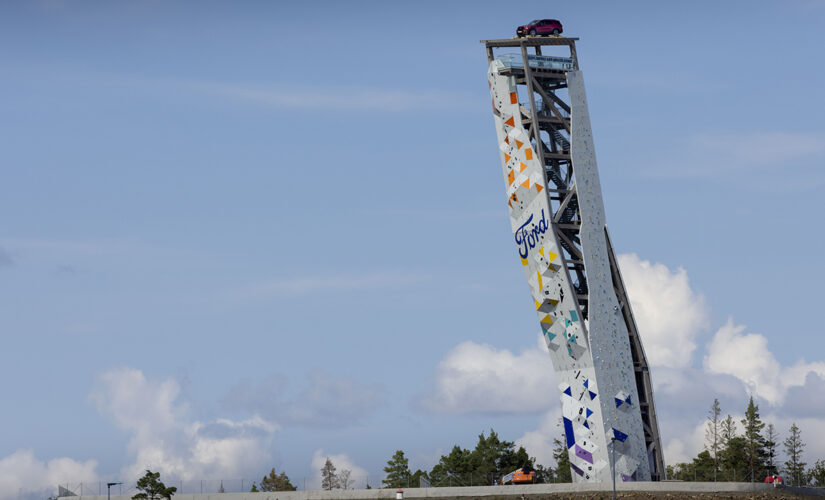 Climber scales tower to win free Ford Explorer parked on top