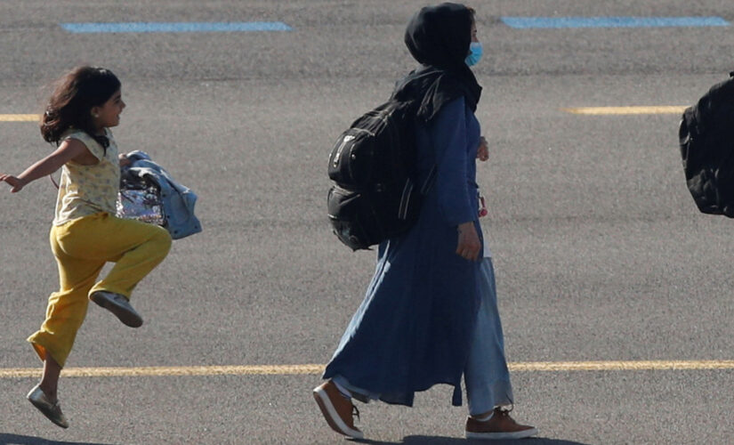 Afghan girl seen in viral photo skipping on airport tarmac after arriving in Brussels following evacuation