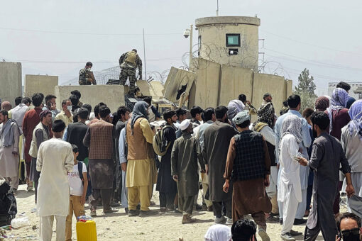 Video shows Afghans passing baby off to troops to escape Taliban