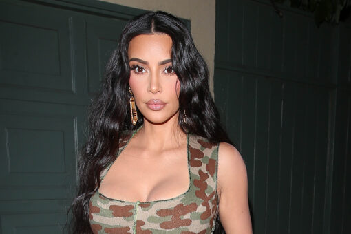 Kim Kardashian shares her ‘resting beach face’ as she poses in a thong bikini