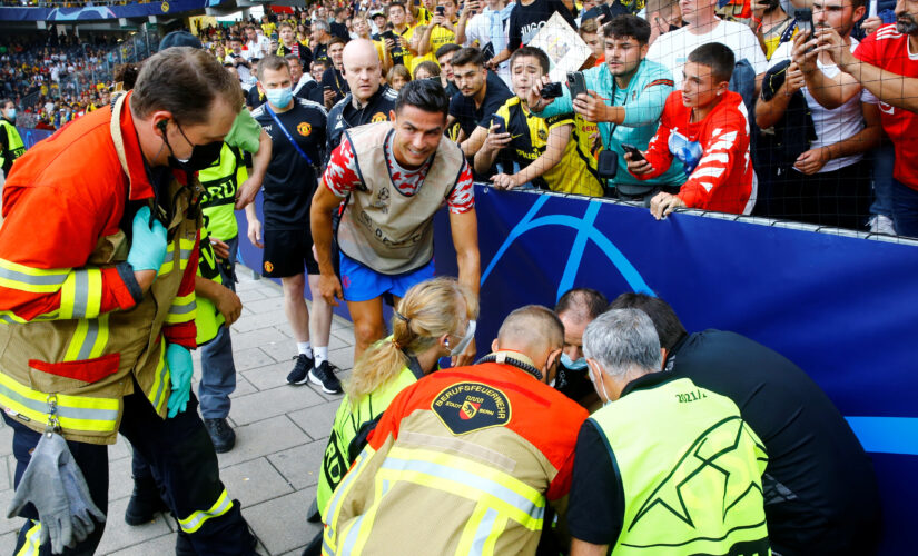 Cristiano Ronaldo drills woman with soccer ball during warmups prior to Champions League match