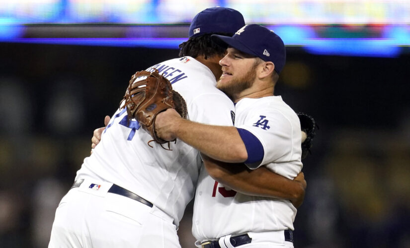 Dodgers clinch postseason berth in 8-4 win over D-backs