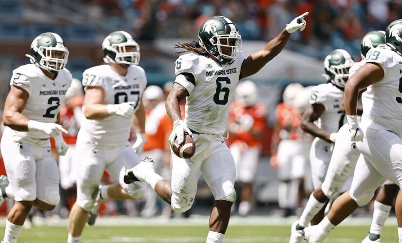 Spartans run: Michigan State rolls past No. 24 Miami, 38-17