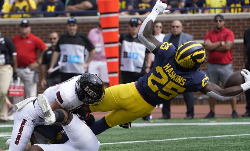 Corum’s 3 TDs help No. 25 Michigan rout N. Illinois 63-10