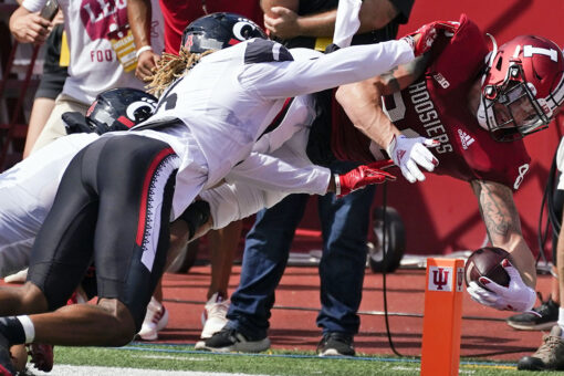 Ridder helps No. 8 Bearcats rally for 38-24 win at Indiana
