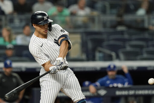 Yankees power past Rangers 7-1 to keep pace in playoff race