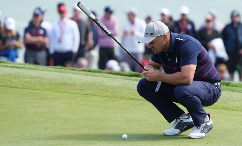 Bryson DeChambeau stares down Europe Ryder Cup team after having to hole out