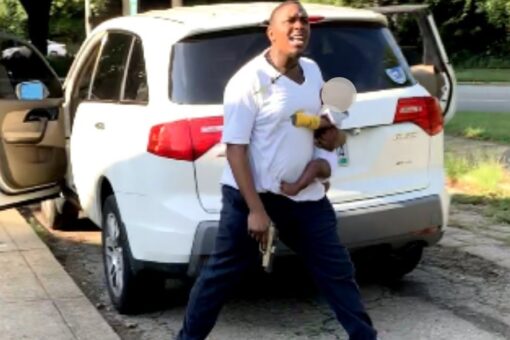Ohio man holds baby as he shoots at, wounds woman following car crash