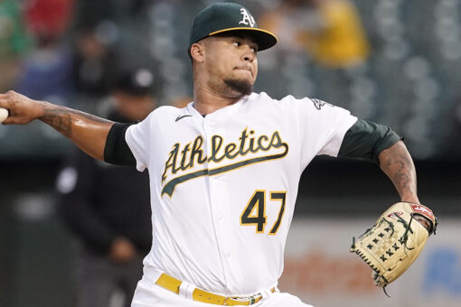 Montas reaches 200 Ks, A’s pound first-place Astros 14-2