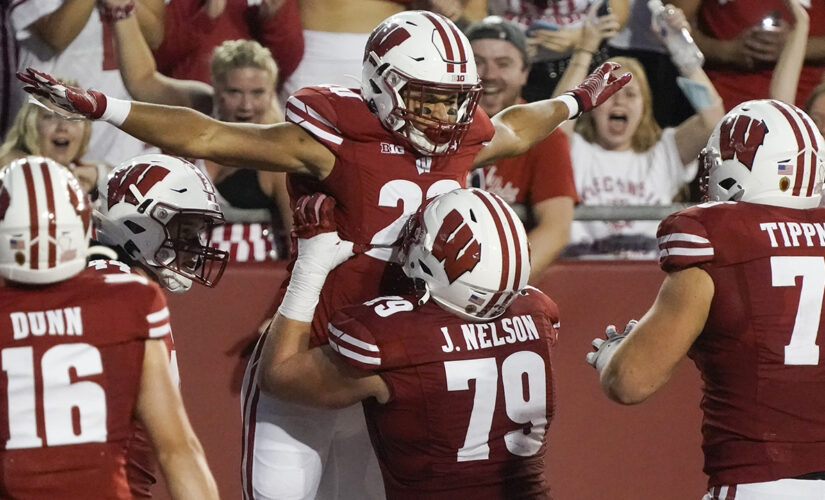 Mellusi powers No. 18 Wisconsin past Eastern Michigan 37-7
