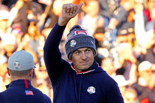 Jordan Spieth somehow gets this shot onto the green and nearly falls into Lake Michigan