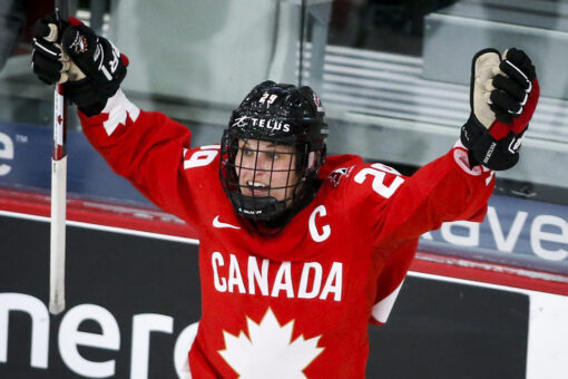 Poulin scores in OT, Canada wins 1st world title since 2012
