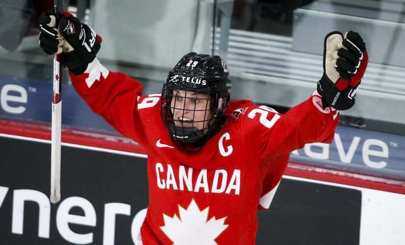Poulin scores in OT, Canada wins 1st world title since 2012