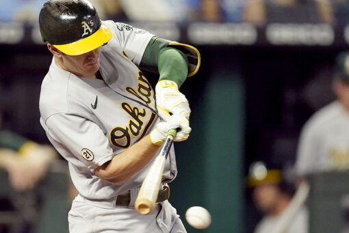 A’s hold off Royals 12-10 to keep pace in AL wild-card race