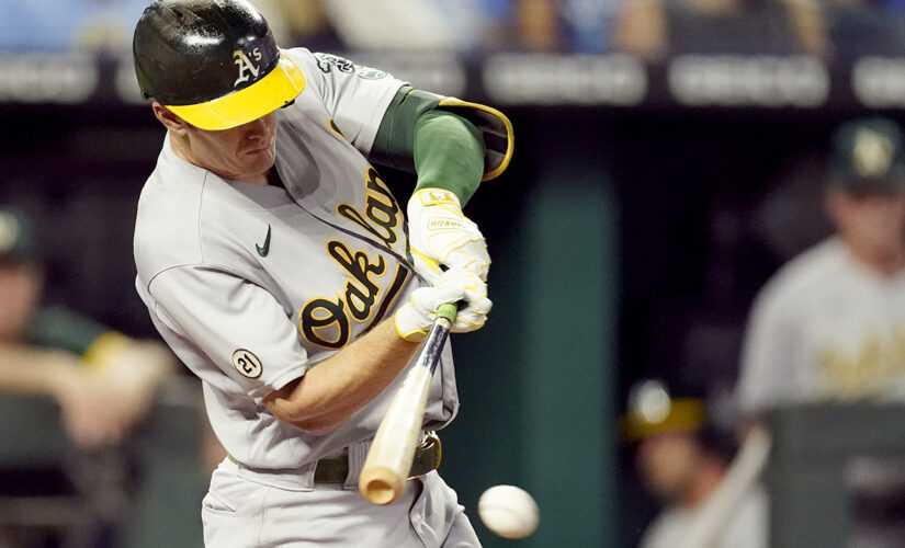 A’s hold off Royals 12-10 to keep pace in AL wild-card race