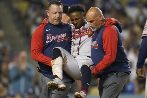 Braves star Albies carried away after fouling ball off knee
