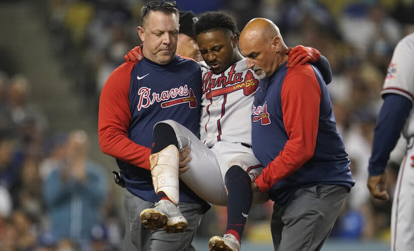Braves star Albies carried away after fouling ball off knee