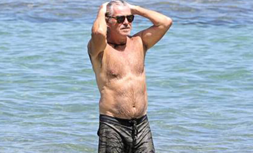 Shirtless Pierce Brosnan takes a dip in Hawaii