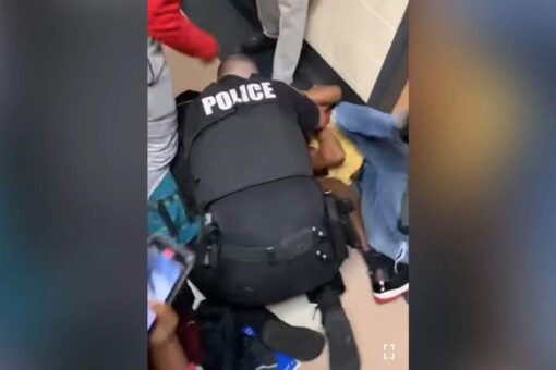 Virginia school resource officer uses body to shield student in high school brawl