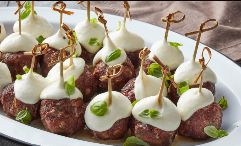 Smoked hickory meatball skewers with mozzarella for football season