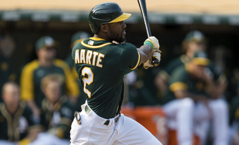 Marte’s double in 9th lifts A’s 2-1, stalls Astros