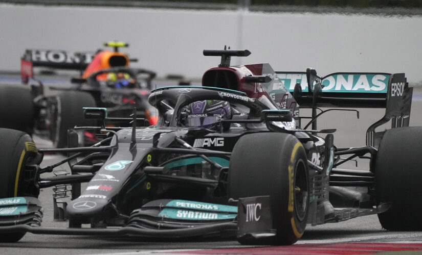 Lewis Hamilton wins record 100th F1 Grand Prix at wet and wild Russia race