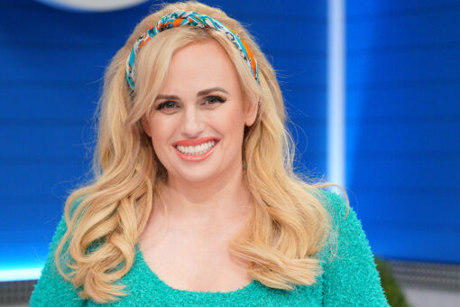 Rebel Wilson tells fans ‘it’s never too late to improve yourself’ while posing in red hot swimsuit