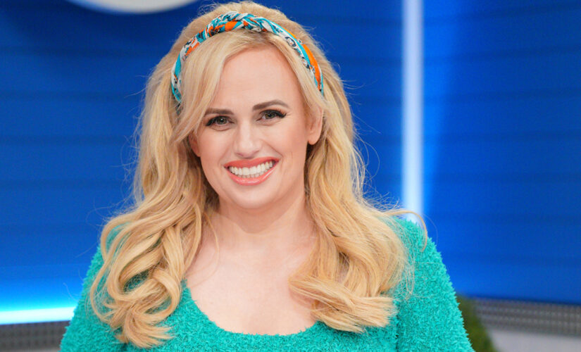 Rebel Wilson tells fans ‘it’s never too late to improve yourself’ while posing in red hot swimsuit