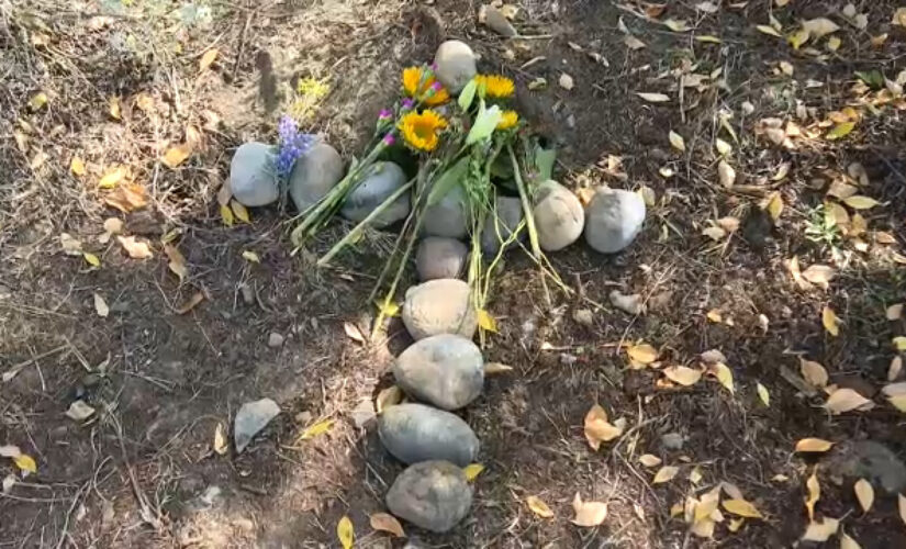 Gabby Petito’s stepfather lays a stone cross at spot where her remains were found