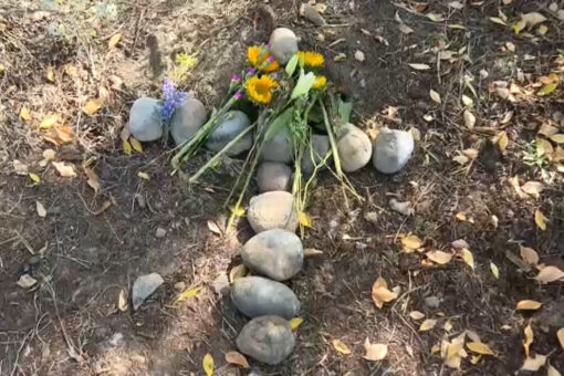 Gabby Petito’s stepfather lays a stone cross at spot where her remains were found