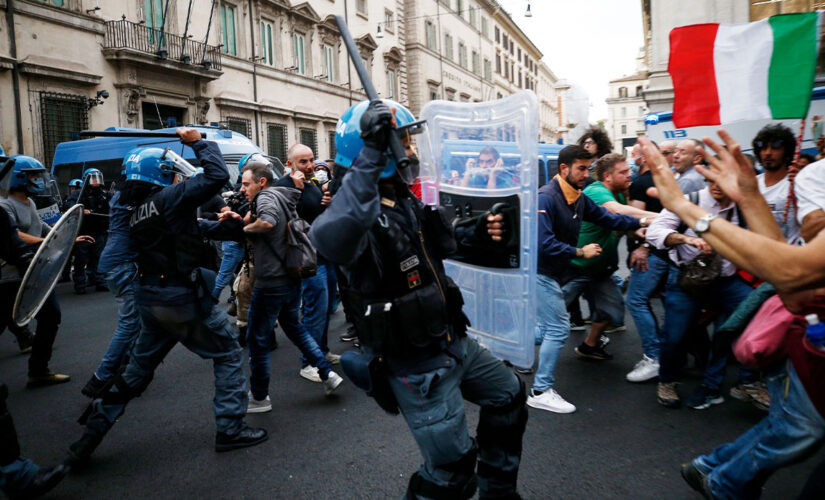 Rome protesters clash with police as thousands pack the streets in opposition to COVID vaccine rule